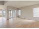 Spacious living room featuring wood flooring, an abundance of light, and patio access at 11491 Alla Breve Cir, Lone Tree, CO 80134