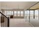 Living room and kitchen area, with open space, big windows, and an outdoor deck at 11491 Alla Breve Cir, Lone Tree, CO 80134