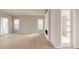 Bright, open living room with modern fireplace and access to outdoor space at 11491 Alla Breve Cir, Lone Tree, CO 80134