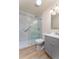 Bathroom featuring modern vanity and walk-in glass shower with tile surround at 3840 Sierra Vista Rd, Monument, CO 80132