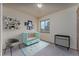A cozy Bedroom featuring stylish decor, a crib, and a large window for natural light at 3840 Sierra Vista Rd, Monument, CO 80132
