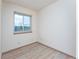 This bedroom features neutral walls, light-colored flooring and a window providing natural light at 3840 Sierra Vista Rd, Monument, CO 80132