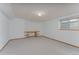 Bedroom featuring a built-in desk, neutral carpet and a small window offering natural light at 3840 Sierra Vista Rd, Monument, CO 80132