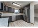 A bright kitchen with granite countertops, stainless steel appliances and grey cabinets at 3840 Sierra Vista Rd, Monument, CO 80132