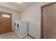 Convenient laundry room with washer, dryer, and a door to the exterior, plus extra storage at 3840 Sierra Vista Rd, Monument, CO 80132