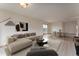 A tastefully furnished living room and dining area with wood-look floors and neutral color palette at 3840 Sierra Vista Rd, Monument, CO 80132