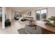 A tastefully furnished living room and dining area with wood-look floors and neutral color palette at 3840 Sierra Vista Rd, Monument, CO 80132