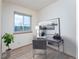Bright office features a sleek desk, modern decor, and large window with scenic outdoor views at 3840 Sierra Vista Rd, Monument, CO 80132