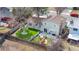 Aerial view of the property highlighting the fenced backyard, play area, and patio at 3930 S Argonne Way, Aurora, CO 80013