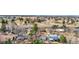 Aerial view of a neighborhood featuring mature trees and community amenities at 3930 S Argonne Way, Aurora, CO 80013