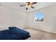 Cozy bedroom featuring a ceiling fan, neutral walls, and carpet flooring at 3930 S Argonne Way, Aurora, CO 80013