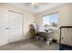 Bright bedroom featuring a window, neutral walls, carpet flooring, and closet at 3930 S Argonne Way, Aurora, CO 80013