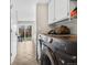 Convenient laundry room with a modern Samsung washer and dryer and outdoor access at 3930 S Argonne Way, Aurora, CO 80013