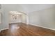 Bright living room featuring hardwood floors and an open archway to the dining area at 13451 Clermont St, Thornton, CO 80241