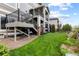 Backyard featuring a well-maintained lawn, patio, and multi-level deck at 5319 W Hoover Dr, Littleton, CO 80123
