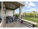 Cozy outdoor balcony with comfortable seating and expansive green views at 5319 W Hoover Dr, Littleton, CO 80123