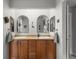 This bathroom features double sinks, sleek fixtures, decorative mirrors, and ample counter space at 5319 W Hoover Dr, Littleton, CO 80123