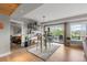 Bright dining area featuring a stylish table set and sliding door to the outdoor patio at 5319 W Hoover Dr, Littleton, CO 80123
