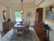 Formal dining room featuring hardwood floors, elegant lighting, and sophisticated decor at 5319 W Hoover Dr, Littleton, CO 80123