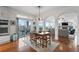 Dining area features outdoor access and views into the Gathering room, adjacent to kitchen at 5319 W Hoover Dr, Littleton, CO 80123