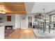 Open dining area showcases stylish light fixture, seating for four, and hardwood floors at 5319 W Hoover Dr, Littleton, CO 80123