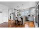 Modern kitchen with granite countertops, stainless steel appliances, and stylish pendant lighting at 5319 W Hoover Dr, Littleton, CO 80123