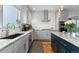 Well-equipped kitchen with stainless appliances, white subway tile backsplash and granite counter tops at 5319 W Hoover Dr, Littleton, CO 80123