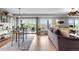 Open living and dining area with access to the balcony; great for entertaining at 5319 W Hoover Dr, Littleton, CO 80123