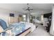 Bright primary suite features vaulted ceiling, ensuite bath, sitting area, and ample closet space at 5319 W Hoover Dr, Littleton, CO 80123