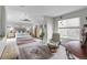 Spacious main bedroom with a ceiling fan, sitting area, and plenty of natural light at 5319 W Hoover Dr, Littleton, CO 80123