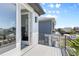 Modern balcony with sleek railings, offering an inviting outdoor space and neighborhood views at 21405 E 59Th Dr, Aurora, CO 80019