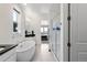 Bathroom with a modern soaking tub, walk-in shower, and sleek fixtures at 21405 E 59Th Dr, Aurora, CO 80019