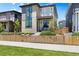 Stylish home with a mix of stone and siding, a balcony, gated front yard and inviting front porch at 21405 E 59Th Dr, Aurora, CO 80019