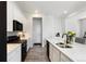 Spacious kitchen with modern finishes, stainless appliances and island at 21405 E 59Th Dr, Aurora, CO 80019