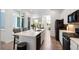 Open kitchen featuring a center island with barstool seating at 21405 E 59Th Dr, Aurora, CO 80019