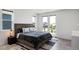Bedroom with a king bed, balcony access, and a view of the neighborhood at 21405 E 59Th Dr, Aurora, CO 80019