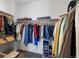 Walk-in closet with ample shelving and hanging space for organized storage at 21405 E 59Th Dr, Aurora, CO 80019