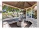 Inviting gazebo featuring a stone-accented firepit and wrap around bench seating for entertaining at 9815 Raleigh St, Westminster, CO 80031