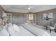 Bright main bedroom featuring French doors to a large ensuite bathroom at 9815 Raleigh St, Westminster, CO 80031