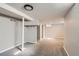 A finished basement with neutral carpet and paint at 3075 Fairfax St, Denver, CO 80207