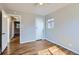 A bedroom with hardwood floors and neutral walls at 3075 Fairfax St, Denver, CO 80207