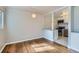 Bright dining area with hardwood floors and adjacent open kitchen at 3075 Fairfax St, Denver, CO 80207