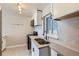 Stylish kitchen with stainless steel appliances, modern counters, and eye-catching backsplash at 3075 Fairfax St, Denver, CO 80207