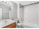 Bathroom features a single sink vanity, large mirror, and a shower and tub at 8237 W 54Th Ave # 2, Arvada, CO 80002