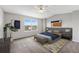 Serene bedroom with large window, neutral tones, ceiling fan, and stylish décor at 8237 W 54Th Ave # 2, Arvada, CO 80002