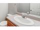 Powder room featuring a single sink vanity and a large mirror at 8237 W 54Th Ave # 2, Arvada, CO 80002