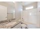 Bathroom with a granite countertop vanity and shower-tub combo at 17717 E 54Th Ave, Denver, CO 80249