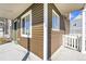 The exterior view features brown siding, a green door, and a white picket fence detail at 17717 E 54Th Ave, Denver, CO 80249