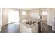 Kitchen with center island, stainless steel sink, and modern appliances at 17717 E 54Th Ave, Denver, CO 80249
