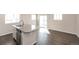 Bright kitchen featuring an island with granite countertops and stainless steel appliances at 17717 E 54Th Ave, Denver, CO 80249